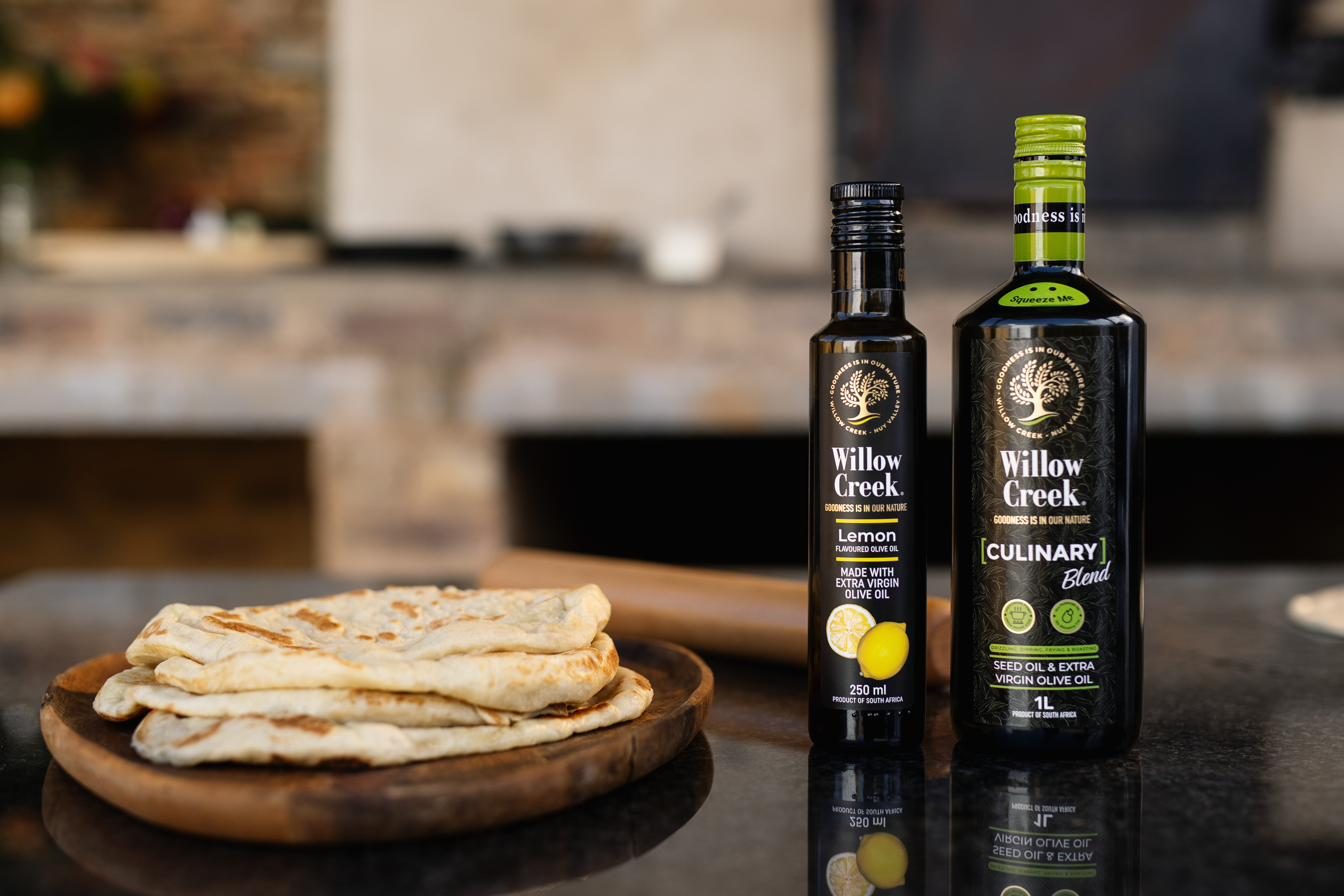 Willow Creek Lemon and Culinary olive oils on a wooden board