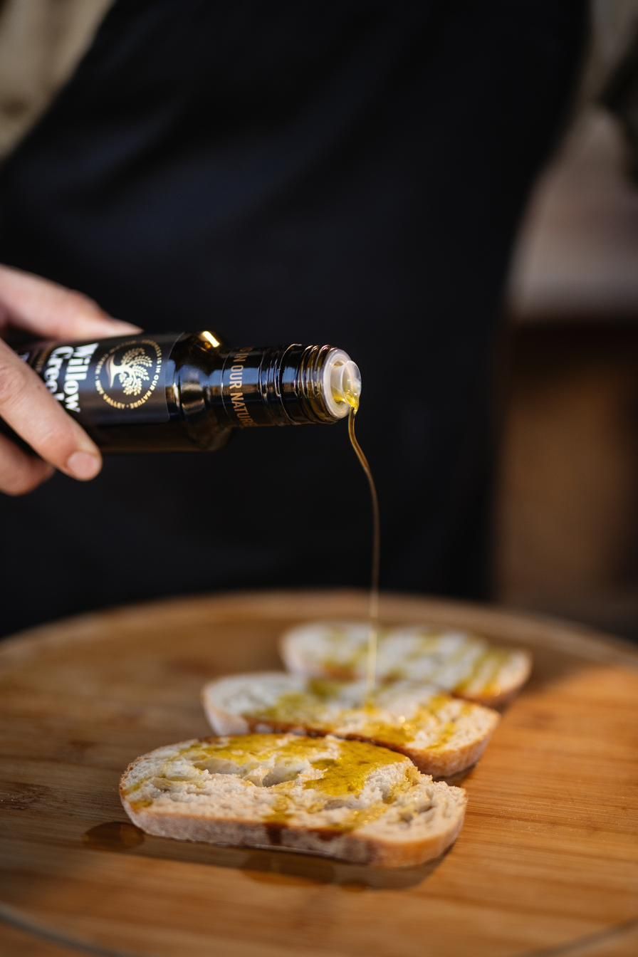 Golden olive oil poured over bread